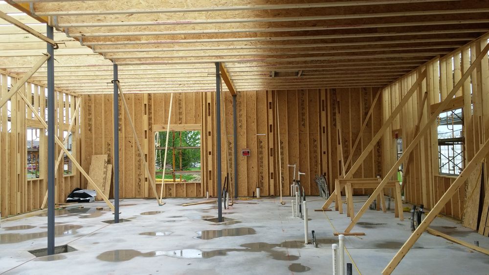 Interior wood framing ongoing for new addition to existing dental clinic.