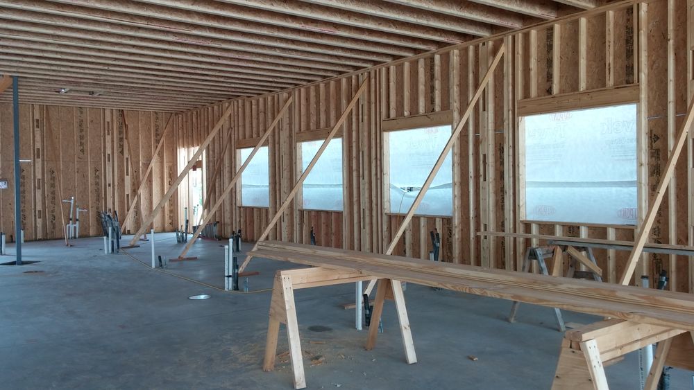 Interior wood framing ongoing for new addition to existing dental clinic.
