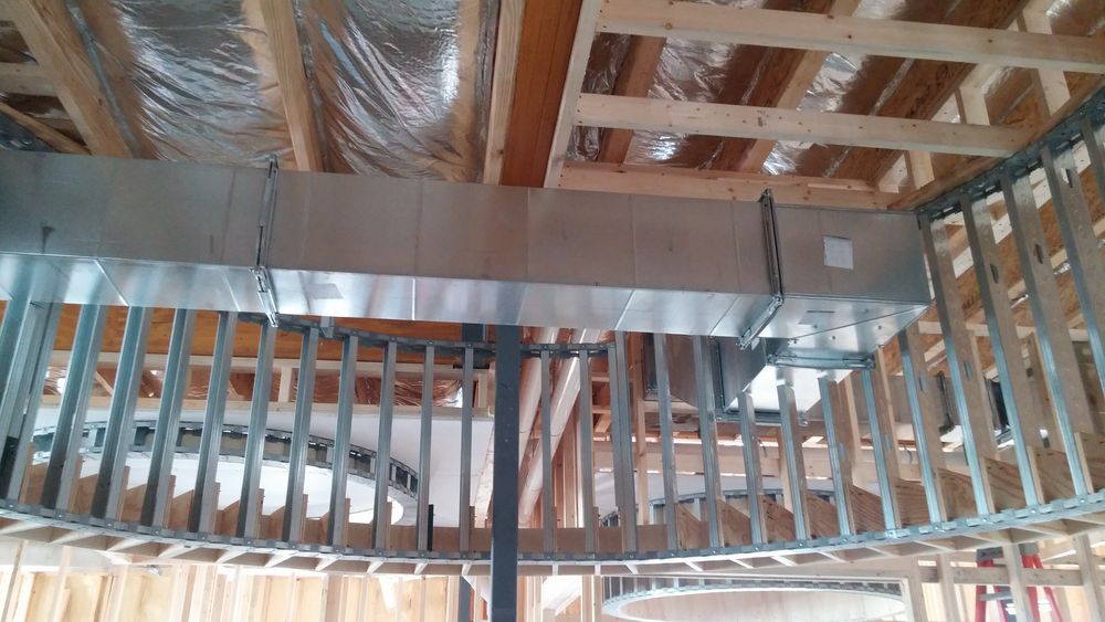 Interior wood and metal stud framing ongoing for decorative ceiling in new addition to existing dental clinic..