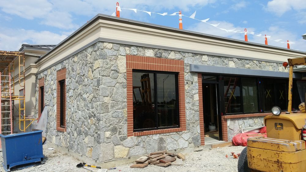 Exterior showing stone veneer masonry on new addition.