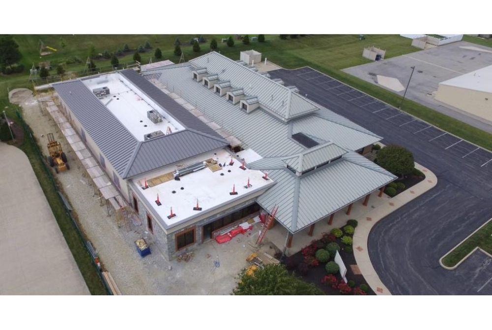 Aerial view showing new addition to existing dental clinic.