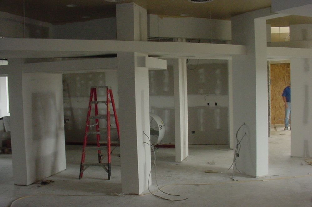 Interior view of new dental center with drywall finishing ongoing.
