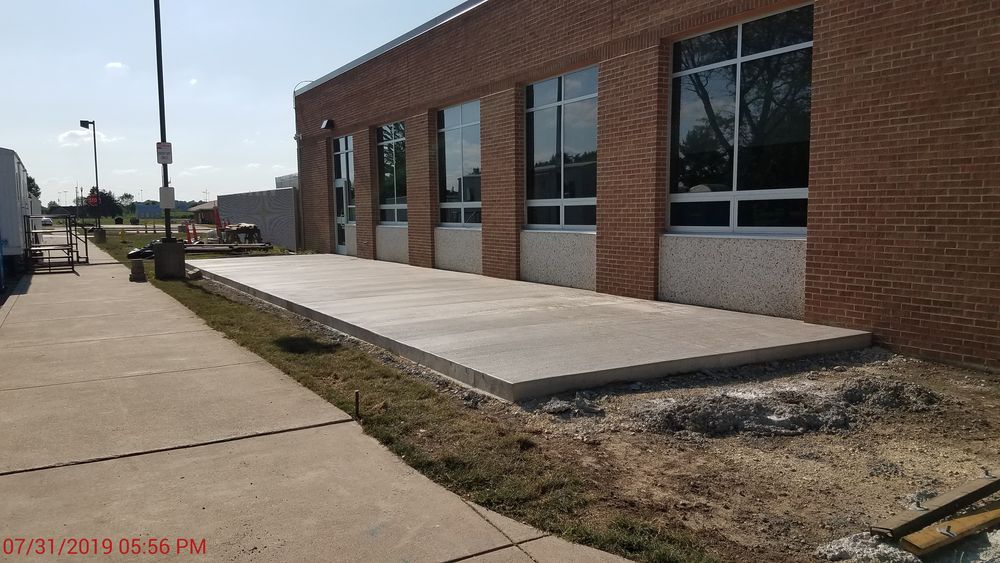 New concrete poured in the front of school.