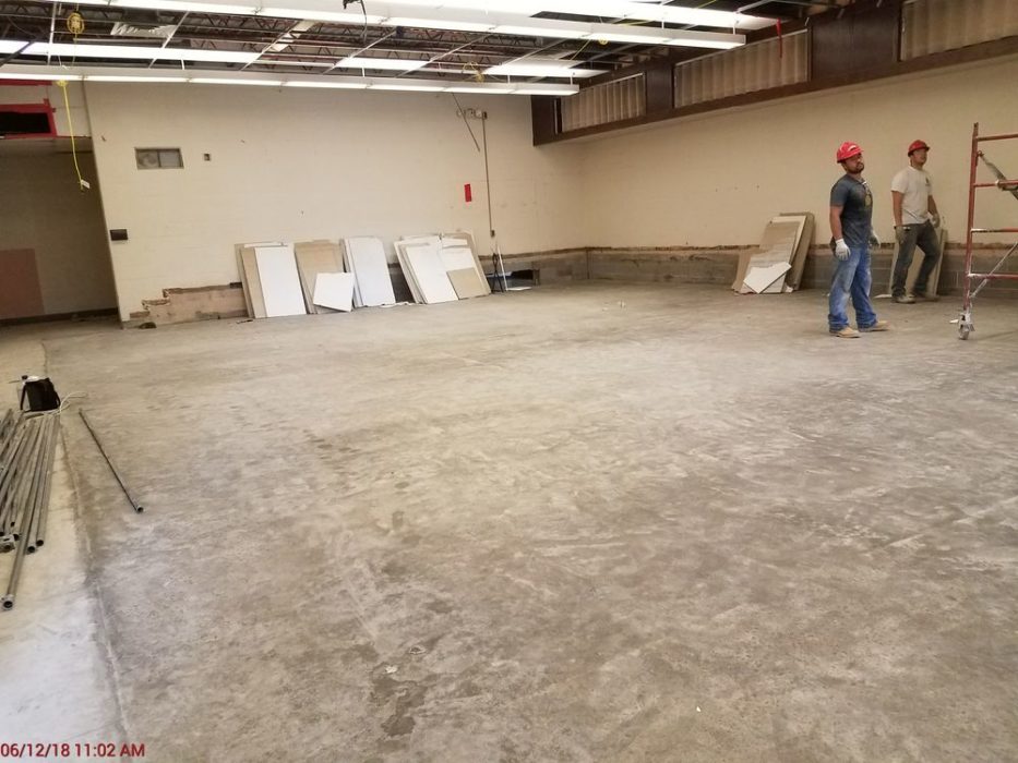 New concrete floor poured in band room.