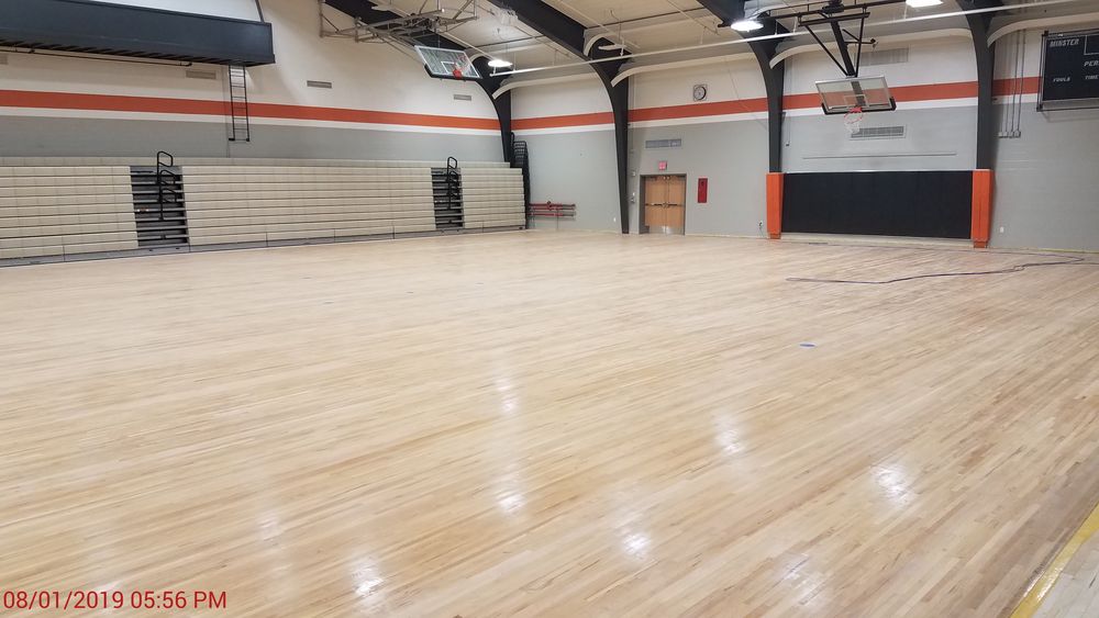Gymnasium floor sanding complete.