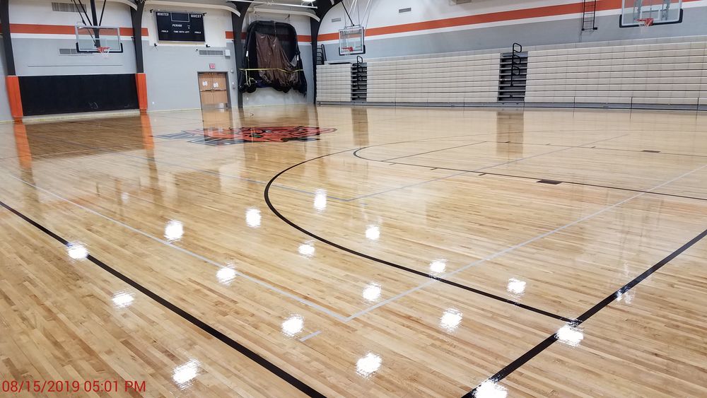 New wood floor finish in gymnasium.