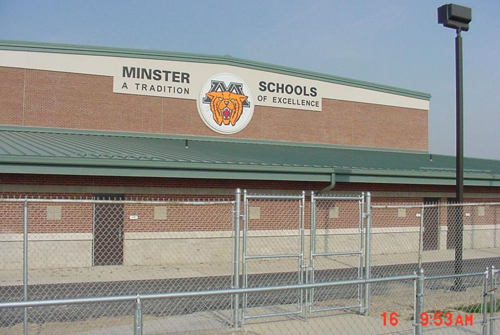 East view of school exterior showing lettering and big Wildcat logo.