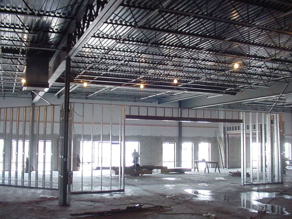 Metal stud framing ongoing for new commercial facility.