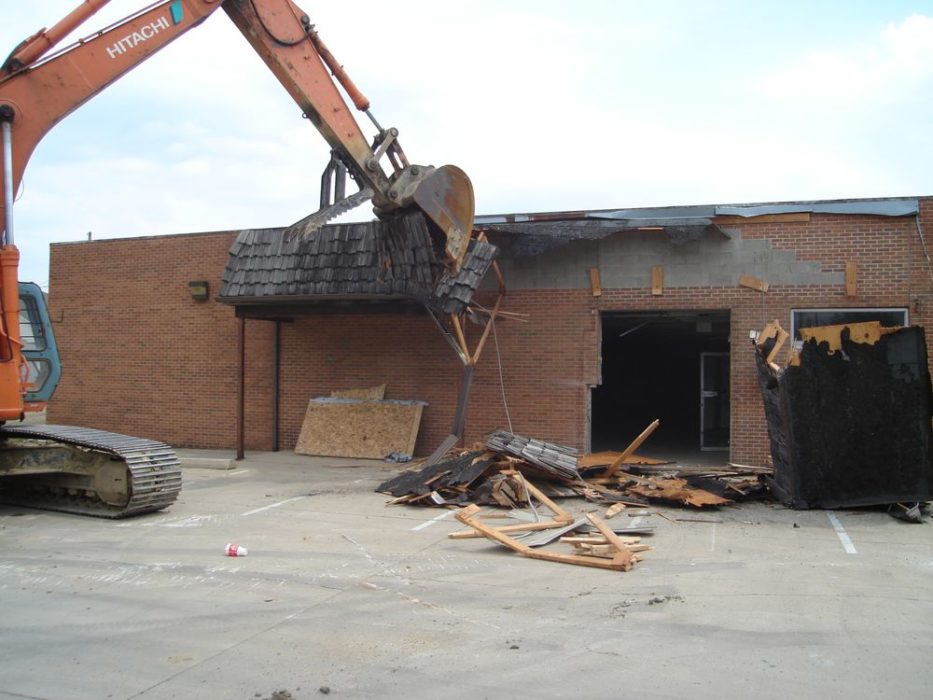 Demolition of old grocery store ongoing.