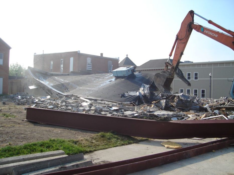 Demolition of old grocery store ongoing.