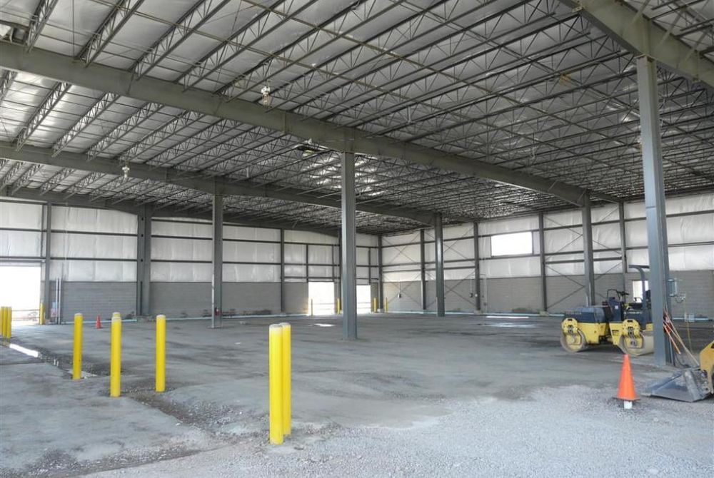 Interior of custom-engineered metal building under construction with preparations being made to pour concrete floor slab.