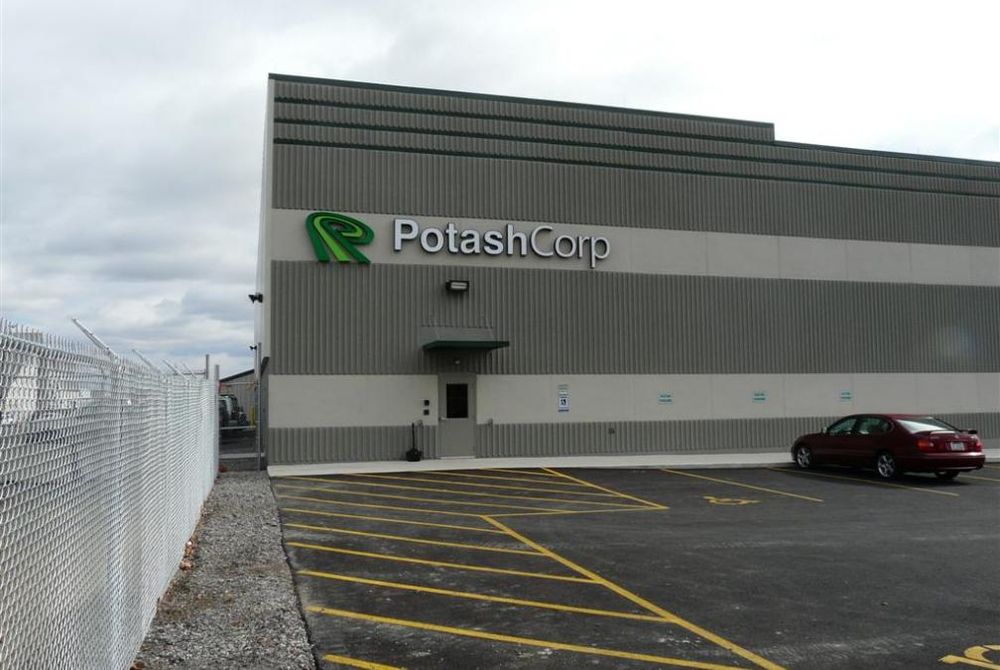 Exterior of custom-engineered metal building with metal wall panels and Potash Corp signage.