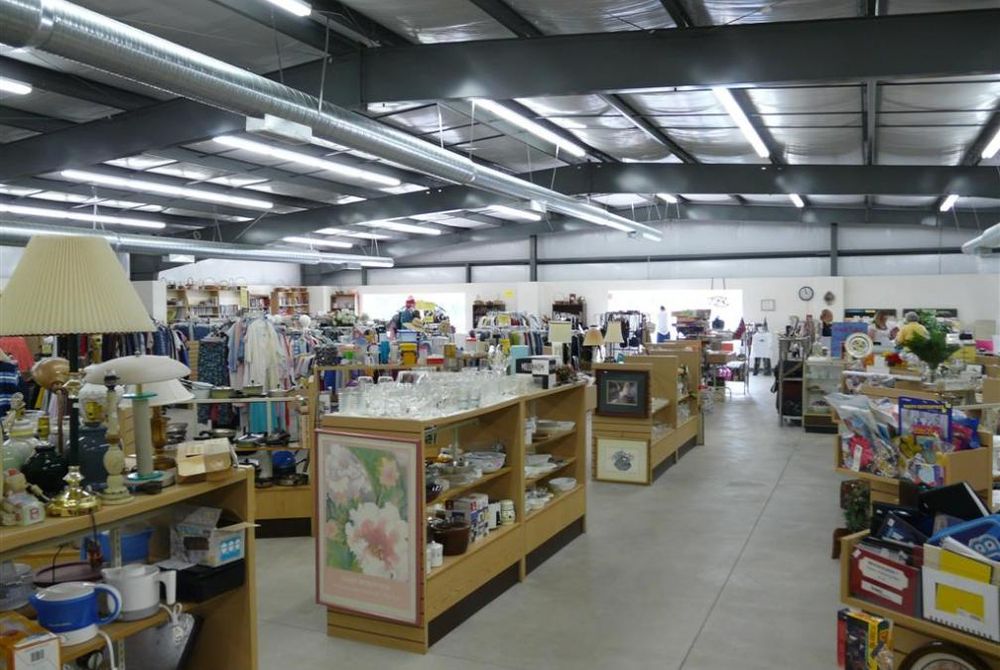 Interior view of completed thrift store for Agape Ministries with items on shelving.