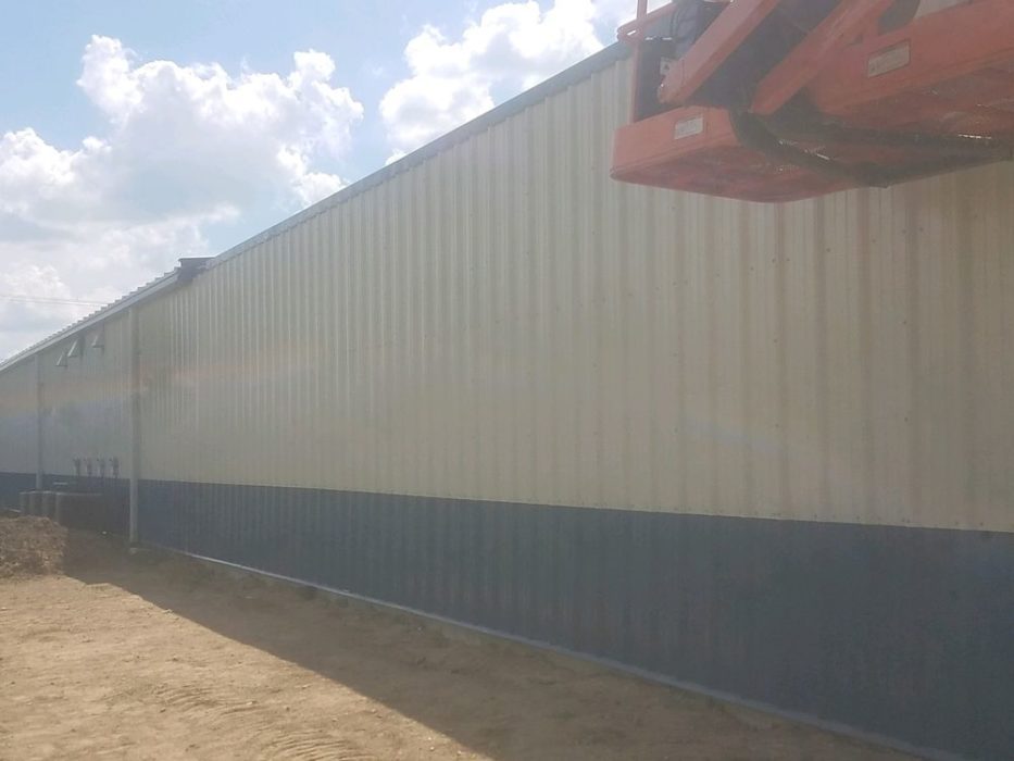 Metal wall panels installed on custom-engineered metal building.