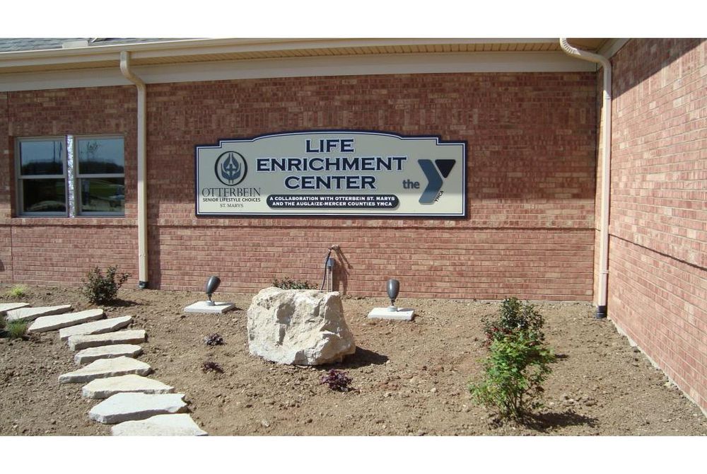 Exterior photo showing the front sign of the nearly finished Otterbein Life Enrichment Center in St. Marys, Ohio.
